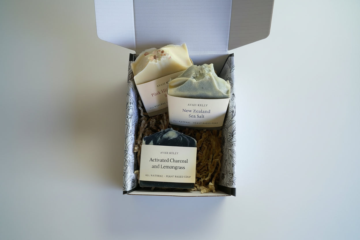 Three soaps in a decorative box with natural elements around